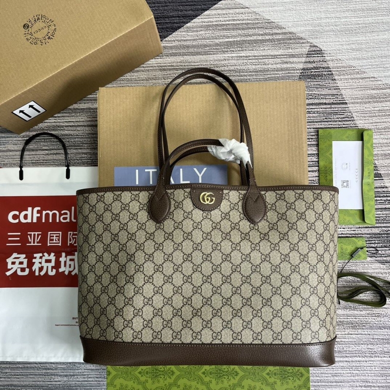 G*u*i shopping bags